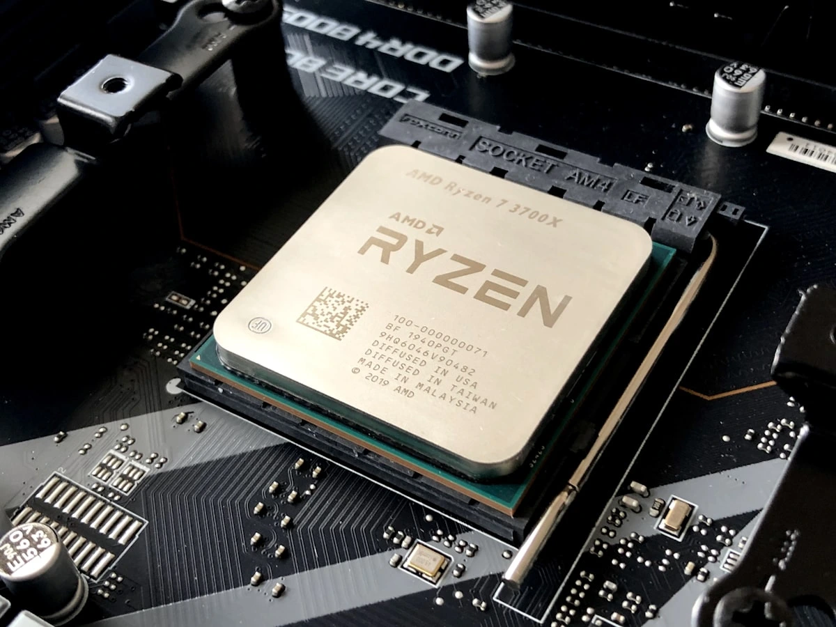 Expert technicians performing chip-level logic board repair on Windows laptops